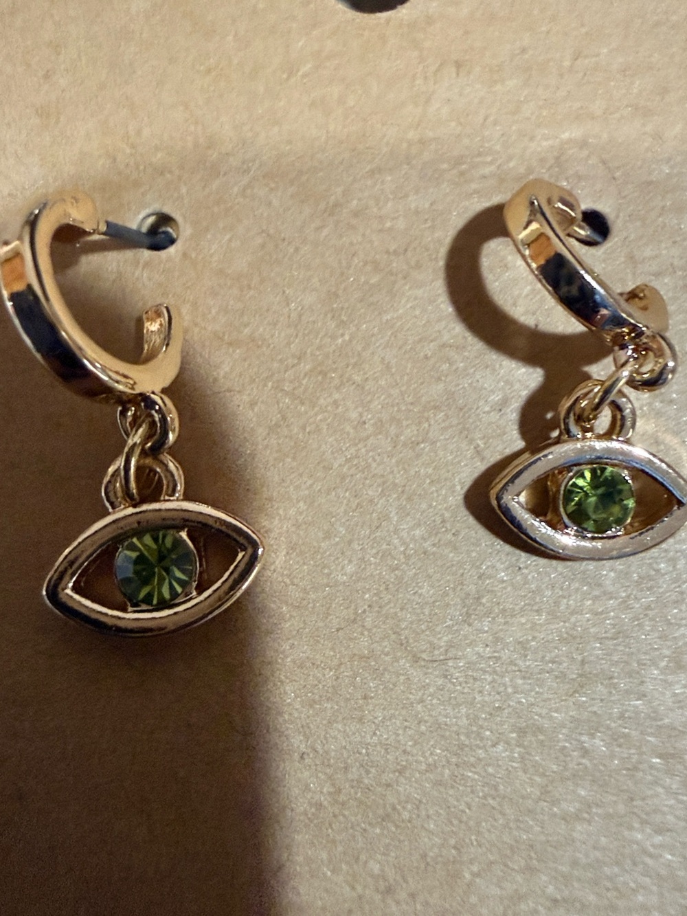 Gold Tone Green Eye Huggie Earrings